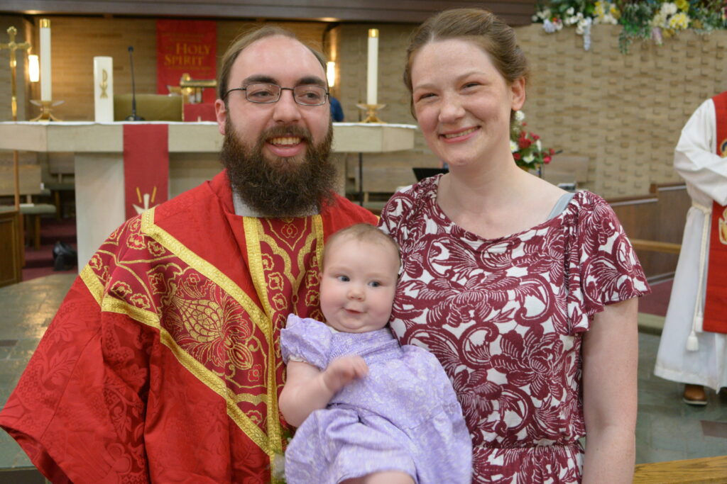 PastorWithFamily Pastor in Church with family